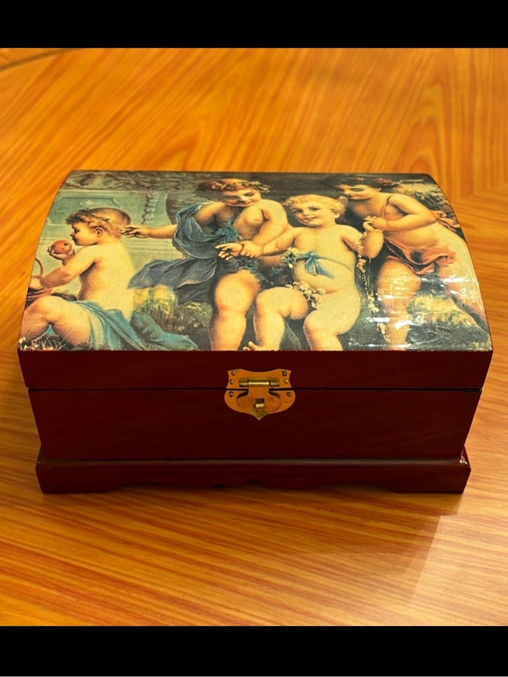 Vintage lacquer jewelry box with angels depicted